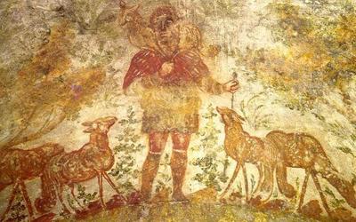 Mural painting of Christ as the Good Shepherd (photo by http://campus.belmont.edu/honors/catacombs/catacombs.htm, public domain)